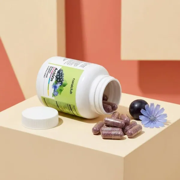 ActiVin dietary supplement bottle with spilled capsules and a flower on a pastel background.