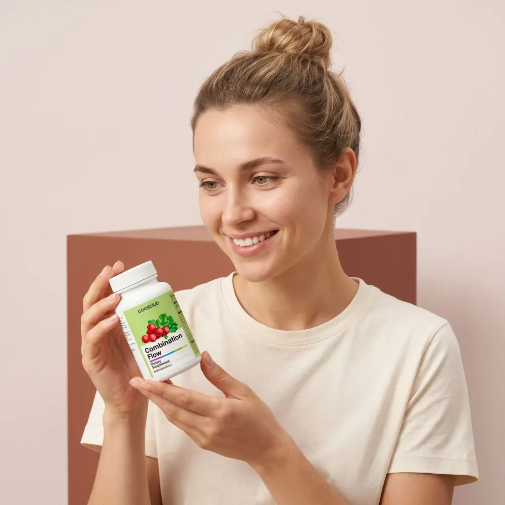 Woman holding Combination Flow supplement bottle in a lifestyle setting.