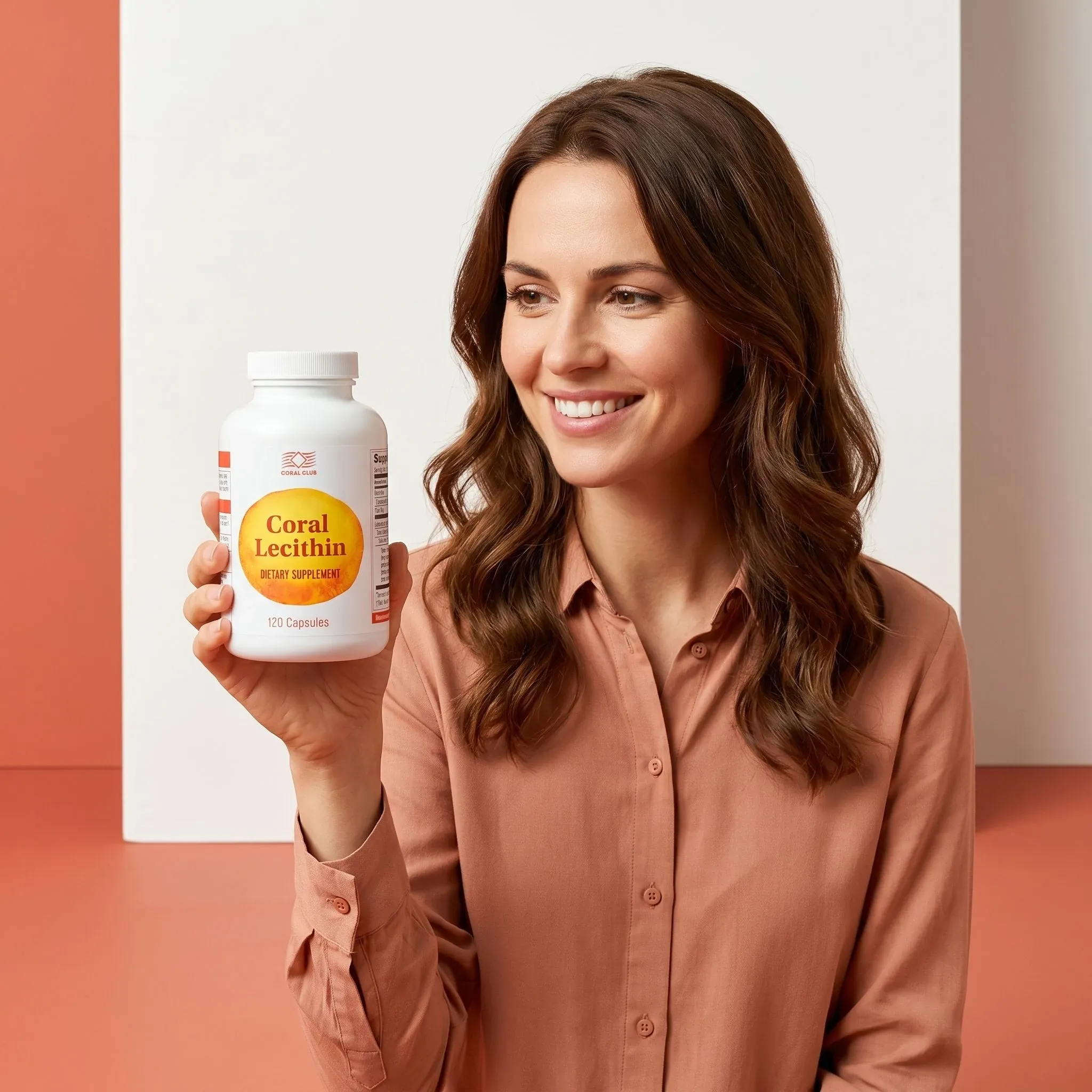 Woman holding a bottle of Coral Lecithin dietary supplement in a lifestyle setting.
