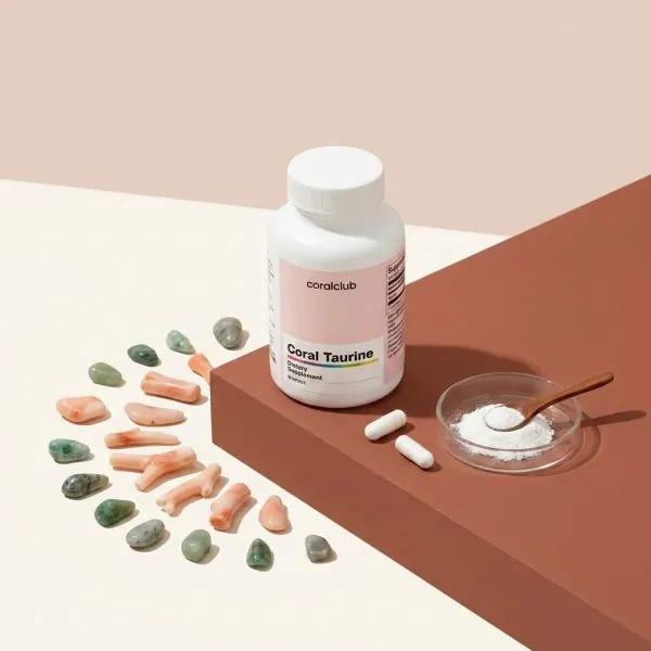 Coral Taurine ingredient with powder, capsules, and coral-shaped elements on a minimalist background.