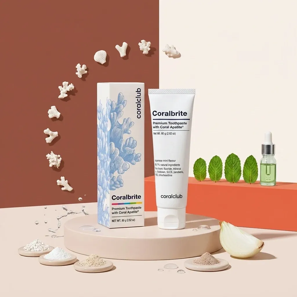 Coralbrite toothpaste with coral calcium, surrounded by natural ingredients like mint and onion.