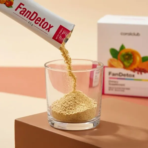 FanDetox powder being poured into a glass, with the product box in the background.