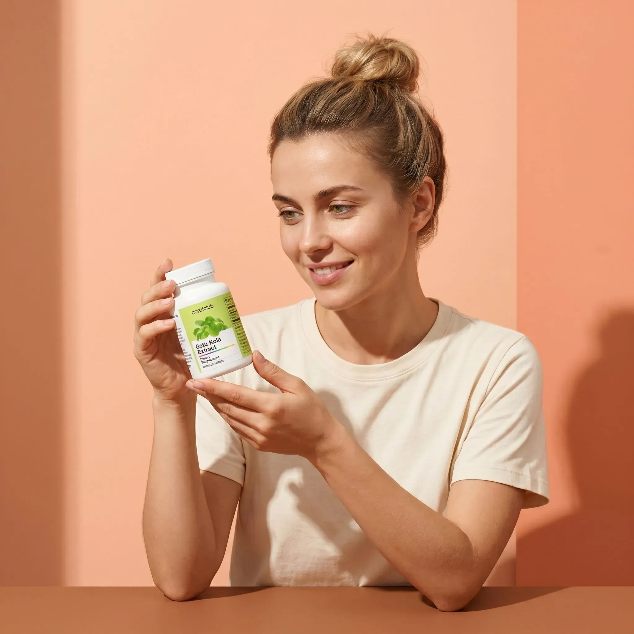 Gotu Kola Extract lifestyle image with a woman holding the supplement bottle against a peach background.