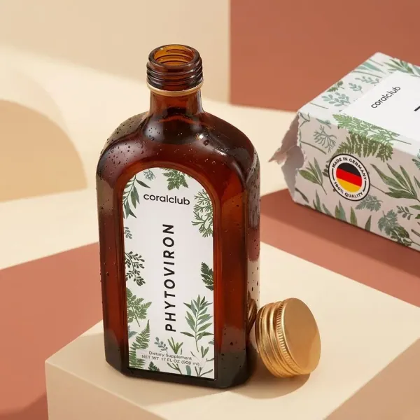 Phytoviron detail shot, amber bottle with botanical design and gold cap on a geometric background.