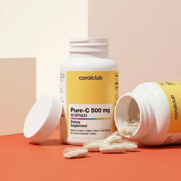 Pure-C 500 mg dietary supplement bottle with capsules spilled, showcasing product details and packaging design.