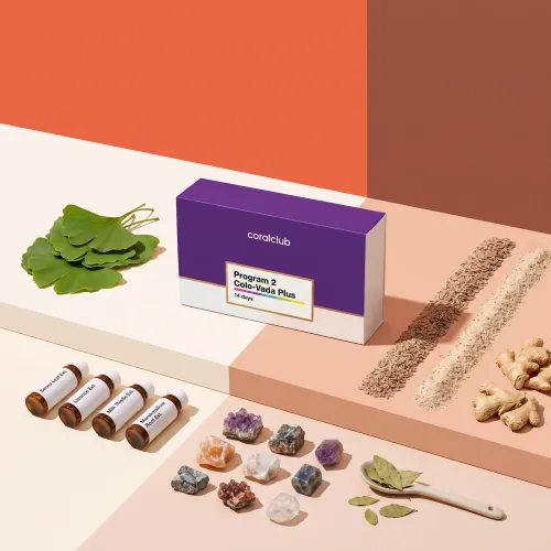 Colo-Vada Plus box with herbal ingredients, seeds and minerals arranged around it.
