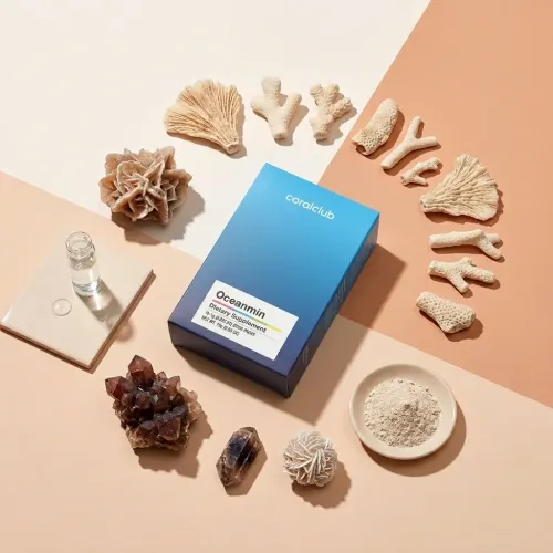 Oceanmin dietary supplement box surrounded by coral and mineral ingredients on a pastel background.