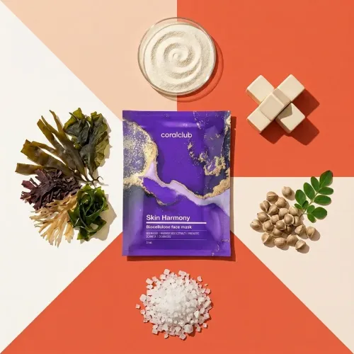 Skin Harmony Biocellulose Facial Mask with seaweed, clay, and natural ingredients on a colorful background.