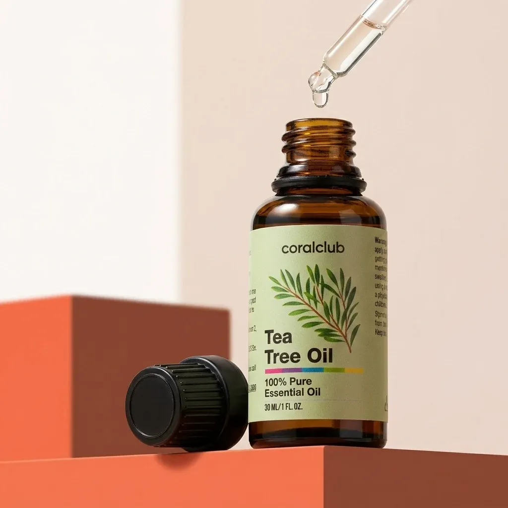 Tea Tree Oil bottle with dropper, showcasing 100% pure essential oil and natural leaf design.