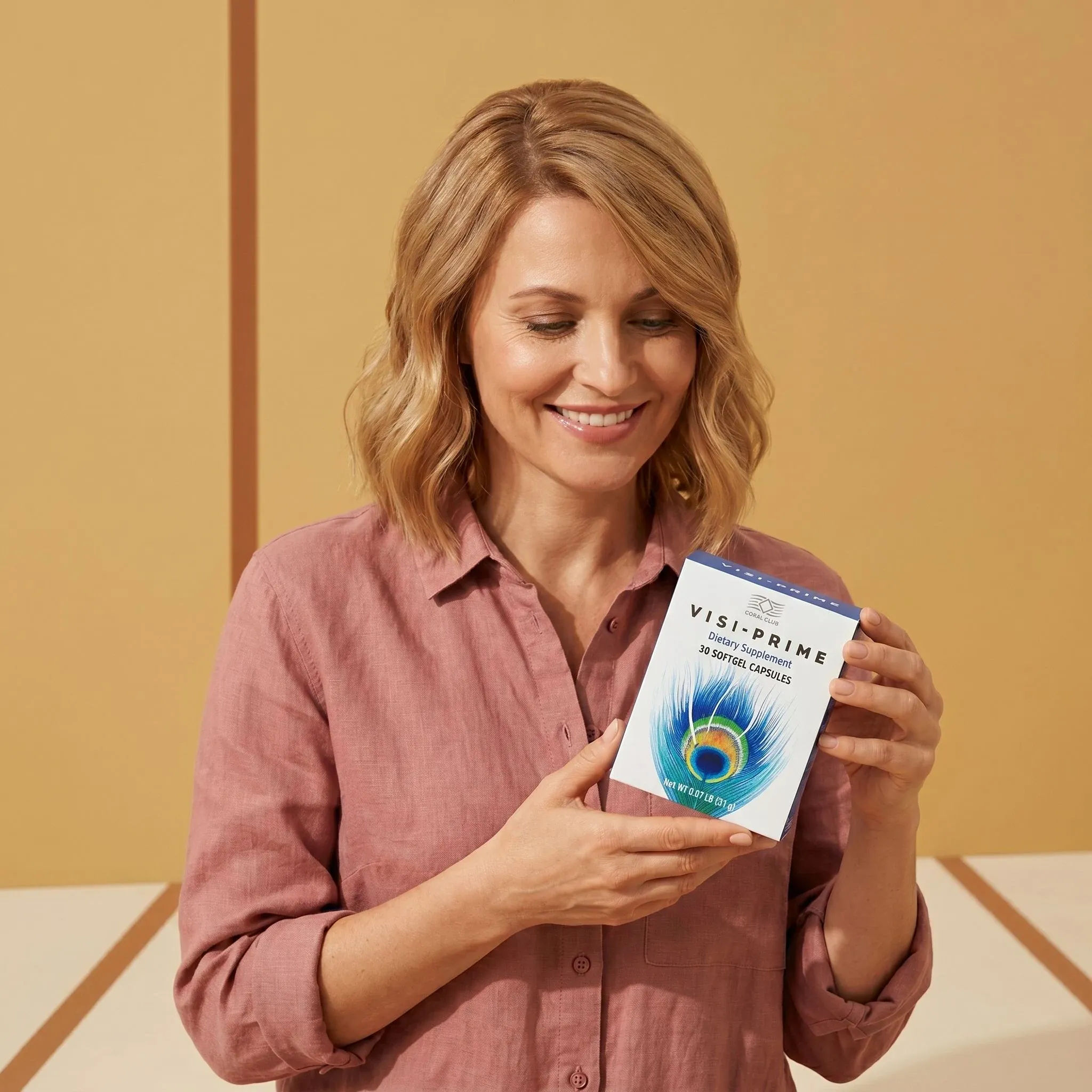 Woman holding Visi-Prime box in a lifestyle setting with a warm background.